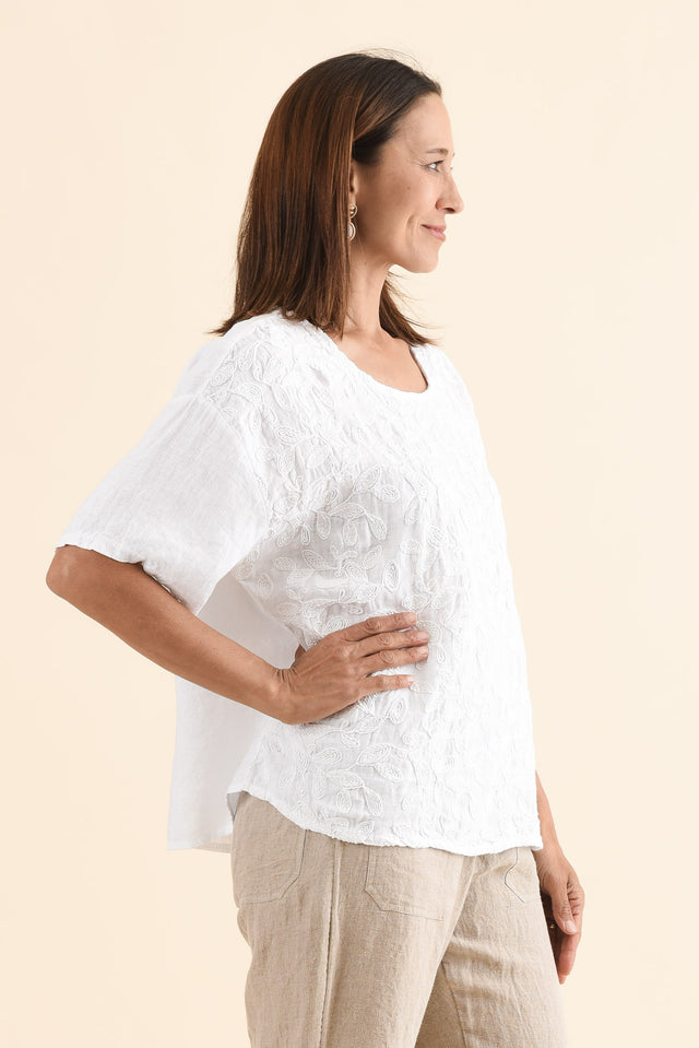 Odia White Abstract Linen Embroidered Top,Side,Brunette model,alt text|model:Cara image 3