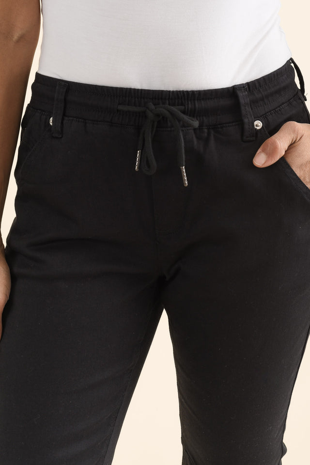 Whistler Black Cotton Jogger Pants,brunette model,Close up of outfit,alt text|model:Cara image 5