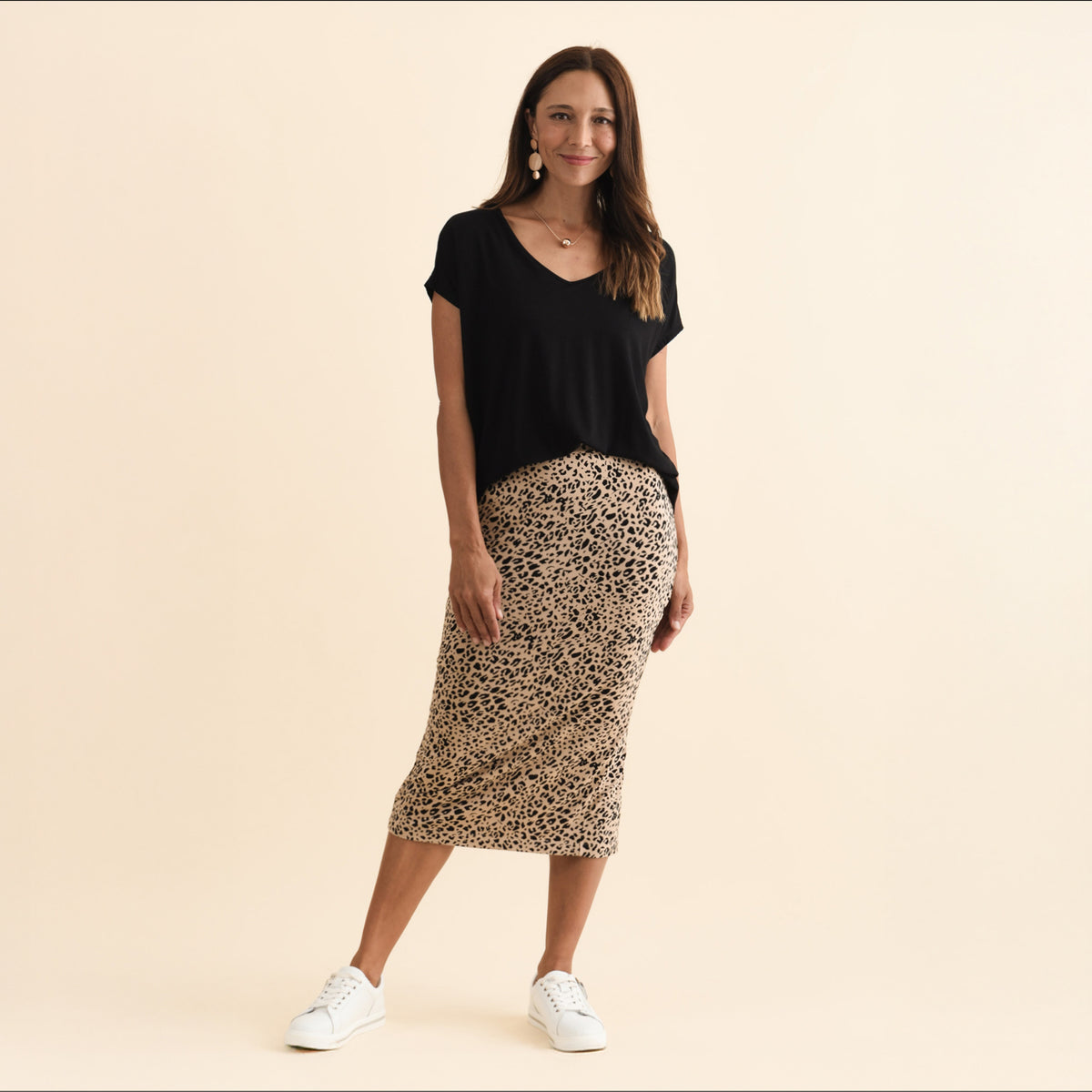 Brunette woman in a leopard print maxi tube bamboo jersey skirt