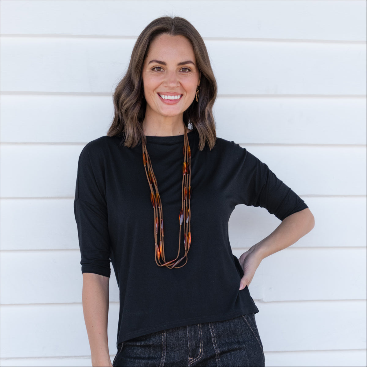 Woman in stretch jersey black neat neckline half or 3/4 sleeve top