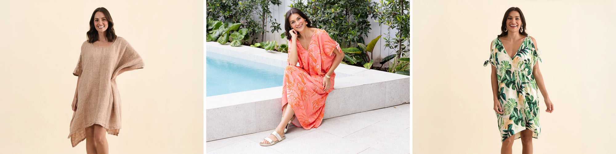 Brunette women in kaftan dresses smile broadly.