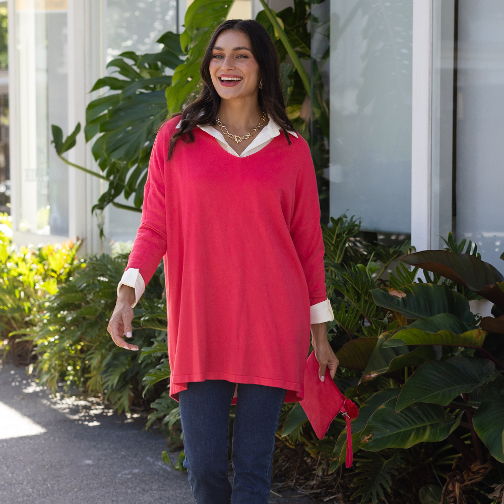 Brunette woman wearing a red cardigan for a date night.